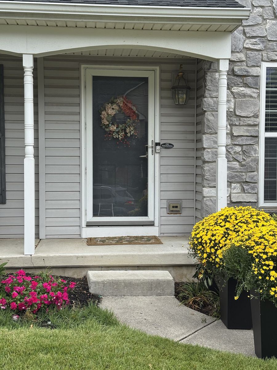 A plain front porch before styling